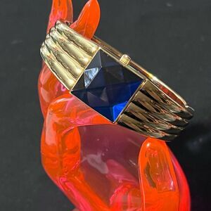 Gruen Gold Tone w/ Blue Gem-Style Cover Hidden Dial Cuff Bracelet Quartz Watch